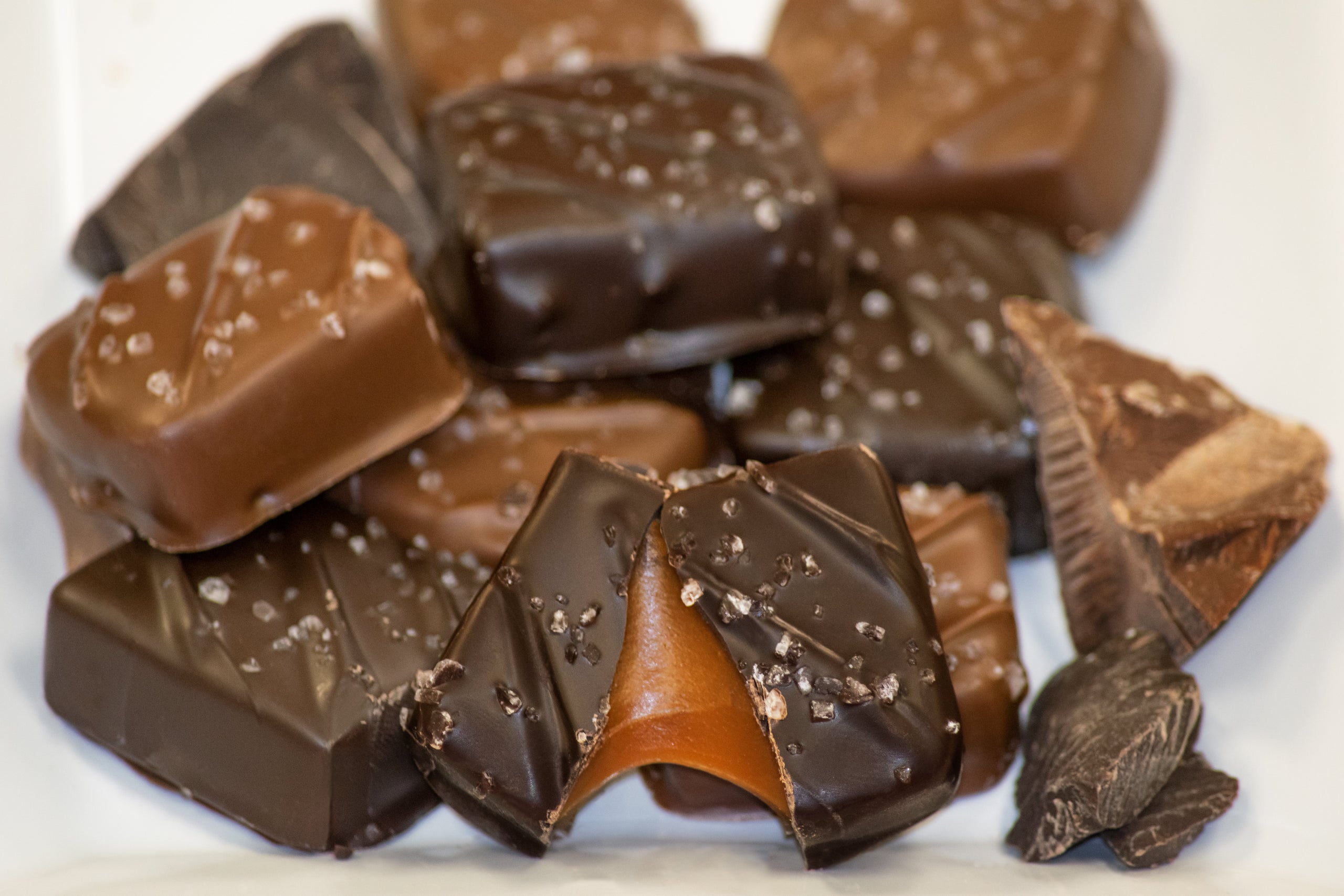 Four assorted chocolatedipped caramels in a clear sleeve. The
