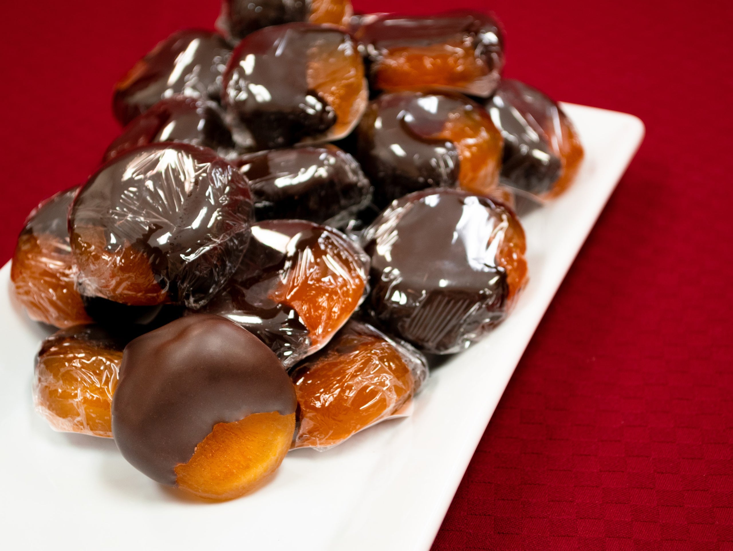 Sweet glacéed apricots dipped in rich, dark chocolate The Chocolate Caper